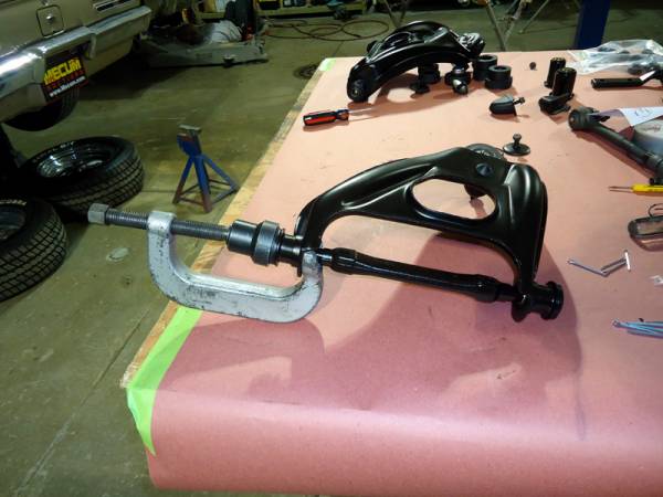 pressing_upper_control_arm_bushings_with_shaft